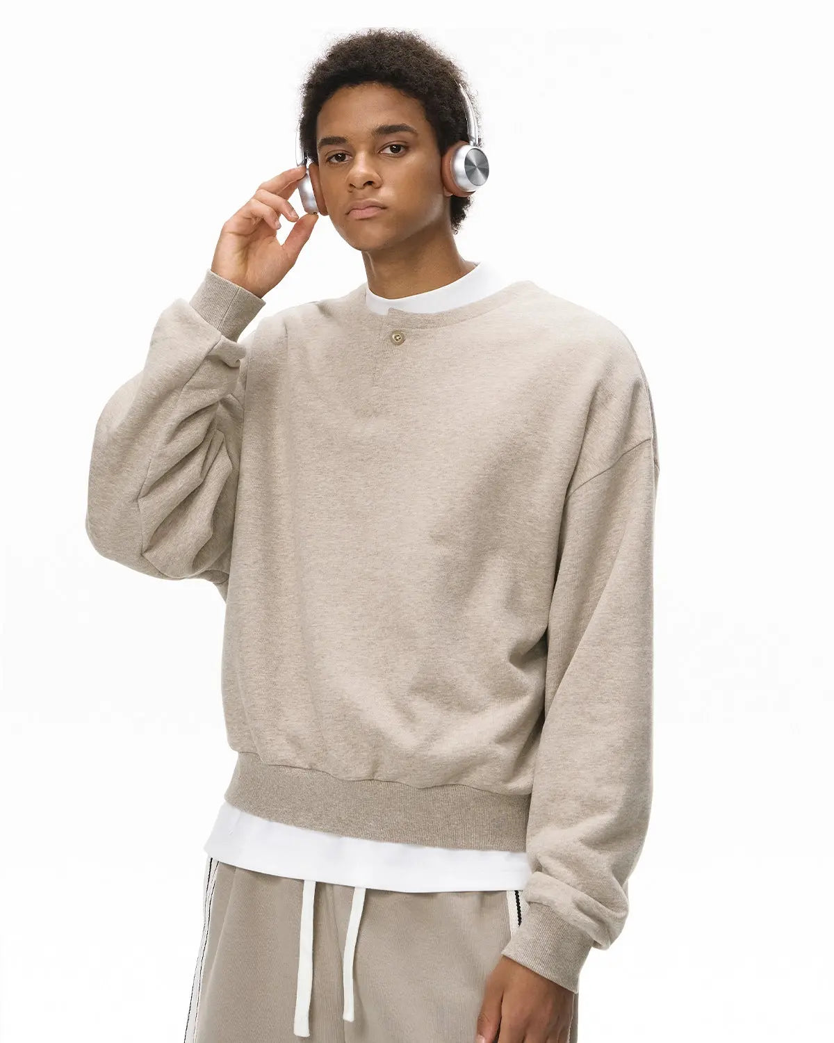 Boxy fit Henley collar sweatshirt by Flation, featuring a casual streetwear style with a comfortable, relaxed fit.