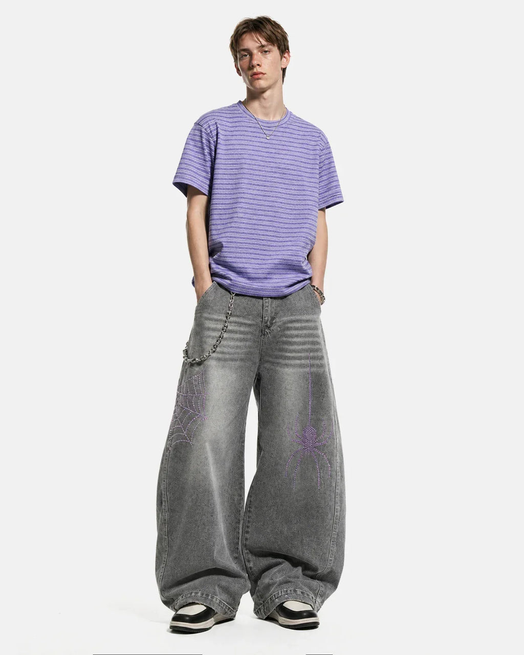 Flation streetwear Spider graphic rhinestone barrel jeans showing detailed spider design and rhinestone embellishments on denim pants.