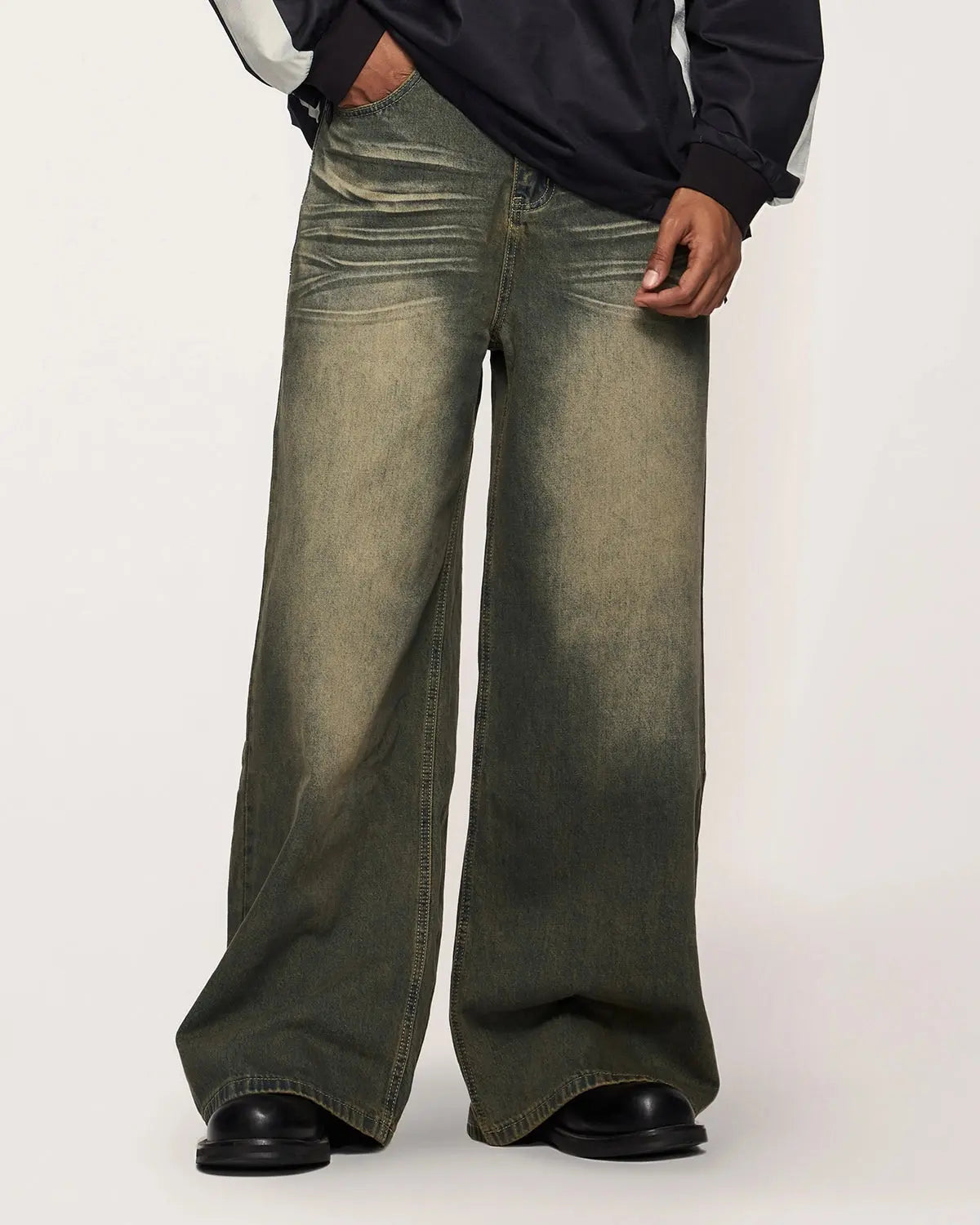 Dark washed loose-fit denim pants from Flation Streetwear with a relaxed style and casual streetwear look.