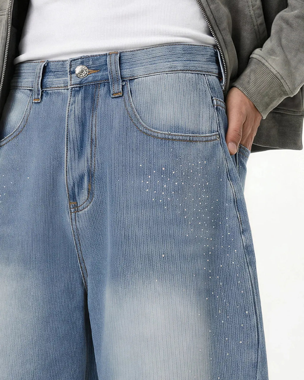 Star rhinestone longline denim shorts by INFLATION featuring distressed details and a relaxed fit, styled as streetwear pants.