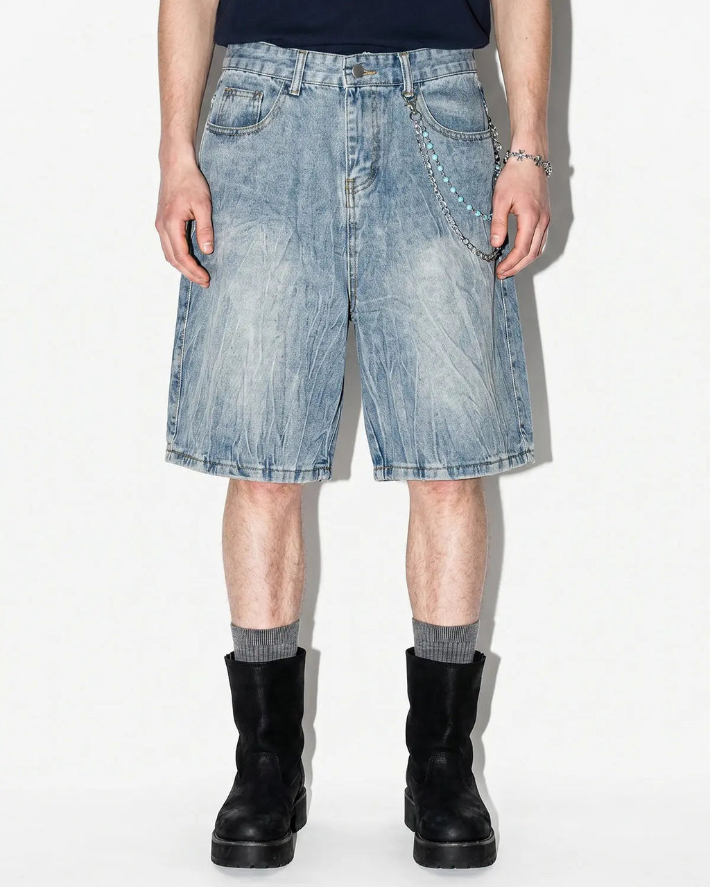 Textured washed longline jorts by INFLATION, casual denim pants with a relaxed fit and distressed wash detail.