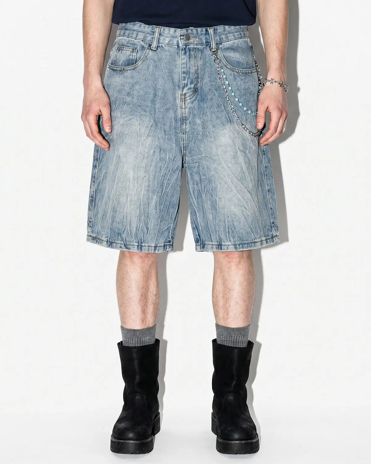 Textured washed longline jorts by INFLATION, casual denim pants with a relaxed fit and distressed wash detail.
