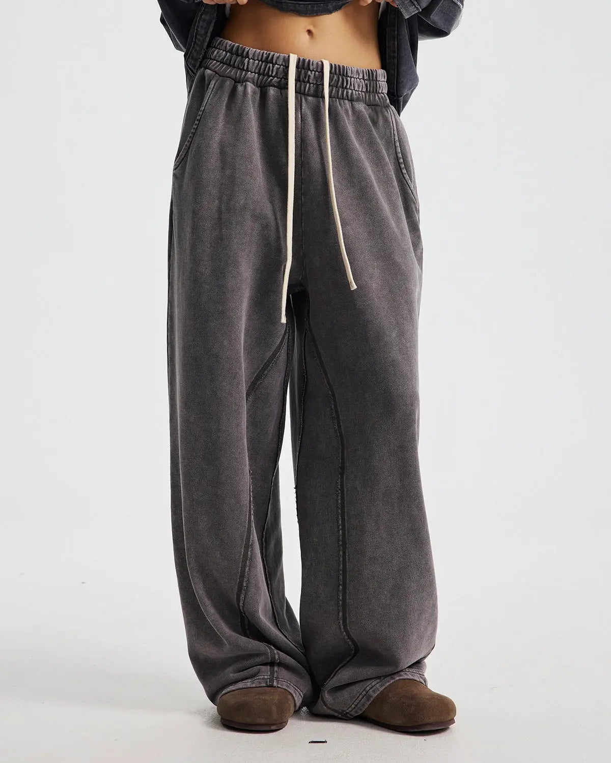 Flation straight leg acid wash sweatpants with relaxed fit and tapered design, showcasing casual streetwear style.