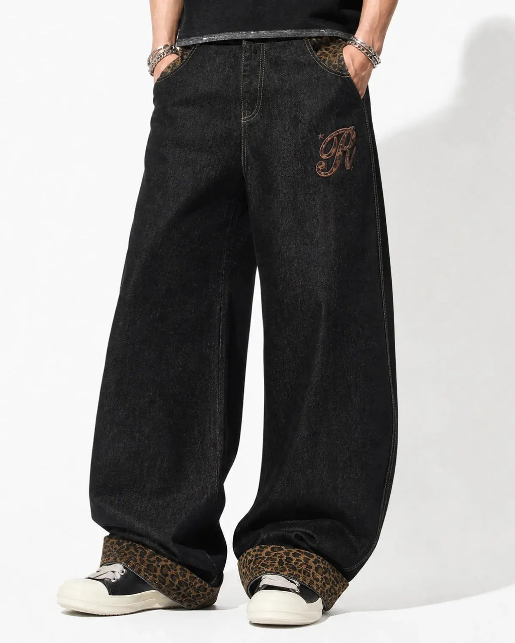Leopard patchwork embroidery baggy jeans by INFLATION featuring bold leopard print, patchwork details, and a relaxed streetwear style.