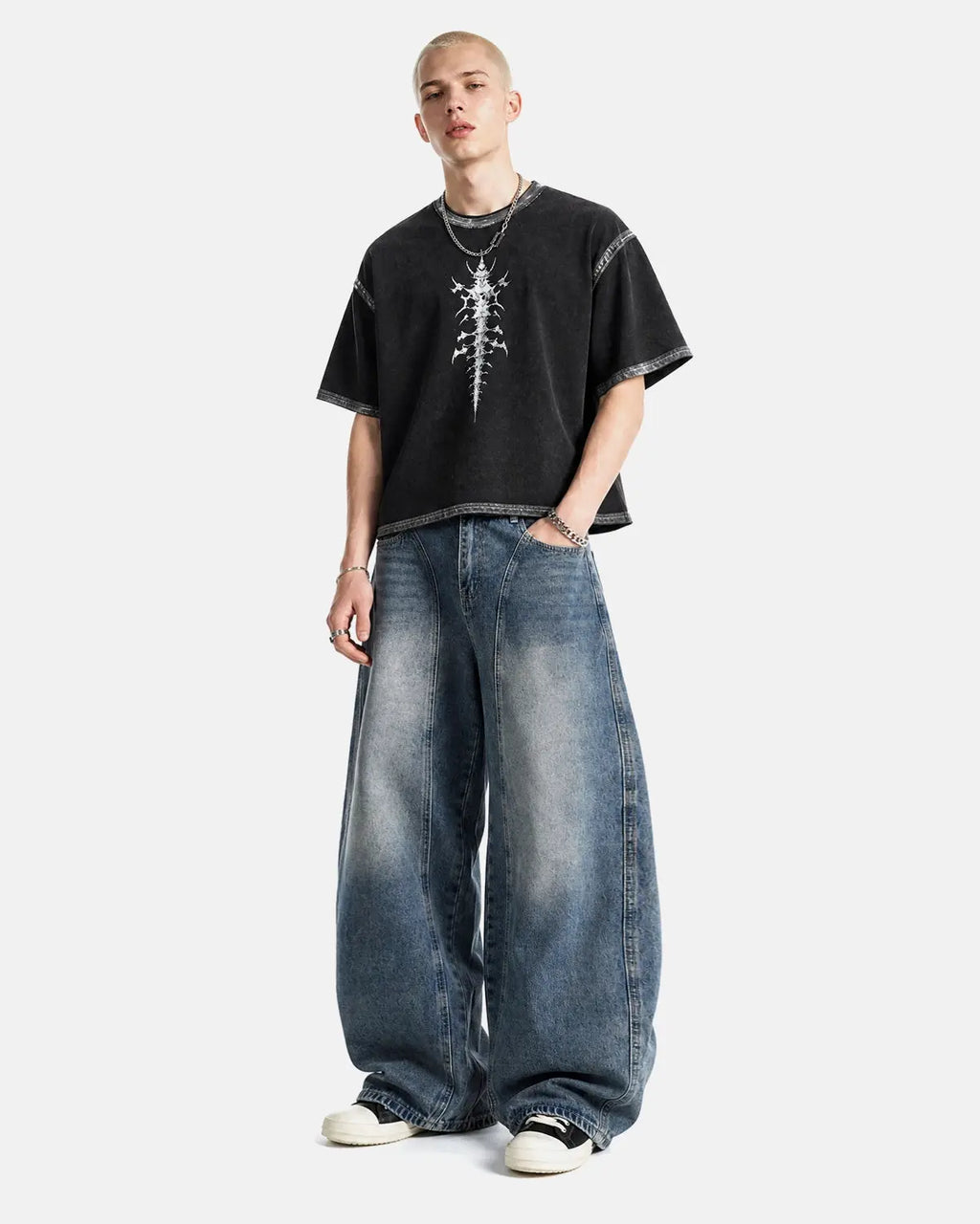 Deconstructed Barrel Jeans by INFLATION, stylish streetwear pants with unique distressed detailing and relaxed fit.