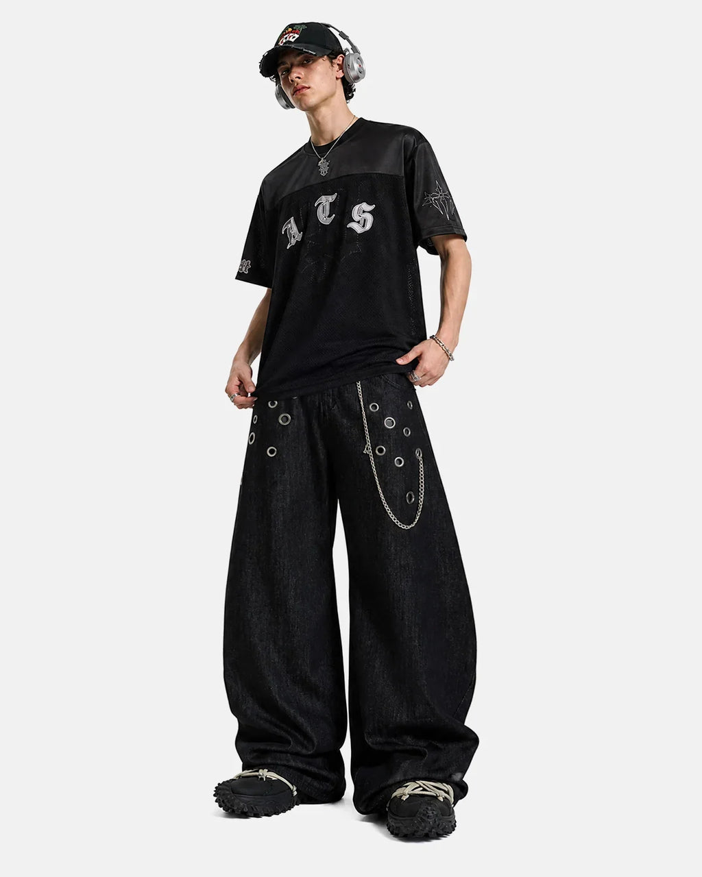 Metal eyelet chain barrel jeans by INFLATION featuring distressed denim, metal eyelets, and a relaxed streetwear fit.