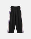 Flation athleisure wide leg baggy pants in soft fabric, relaxed fit with a stylish streetwear look, shown on a model.