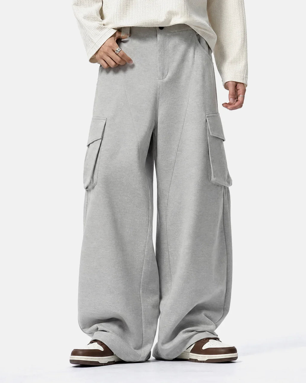 Inflation Streetwear structured wide leg cargo pants with multiple pockets and a relaxed fit, shown in a neutral fabric.