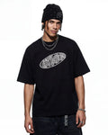 Hollow embroidered graphic T-shirt by INFLATION with intricate embroidery and bold design, casual streetwear style.