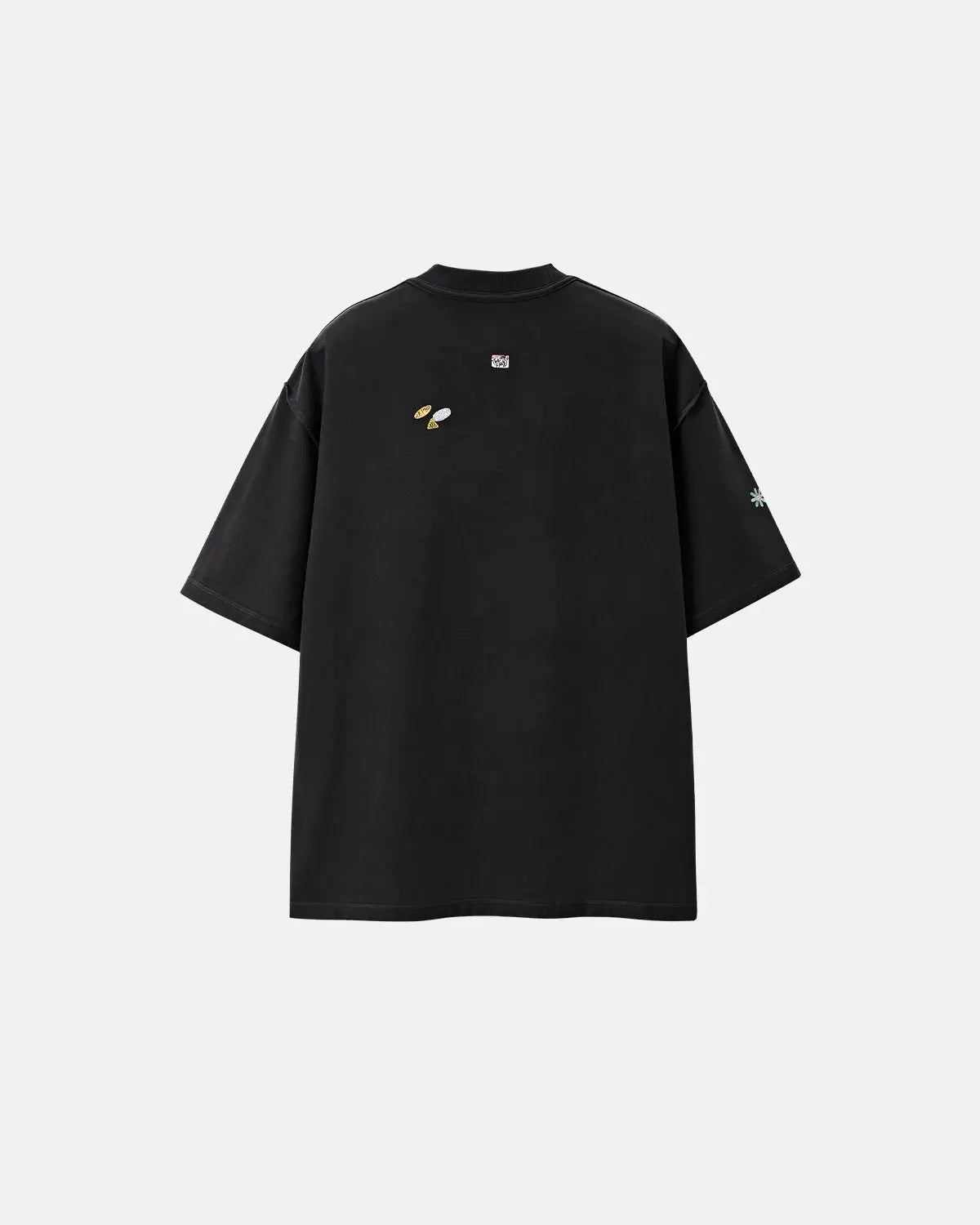 Vintage Sticker Graphic Oversized T-Shirt by Inflation Streetwear with bold, colorful sticker print on soft cotton fabric.
