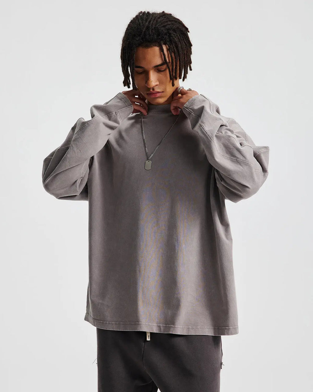 Distressed acid wash oversized long sleeve tee by Flation, featuring a relaxed fit and vintage-style worn-out look.