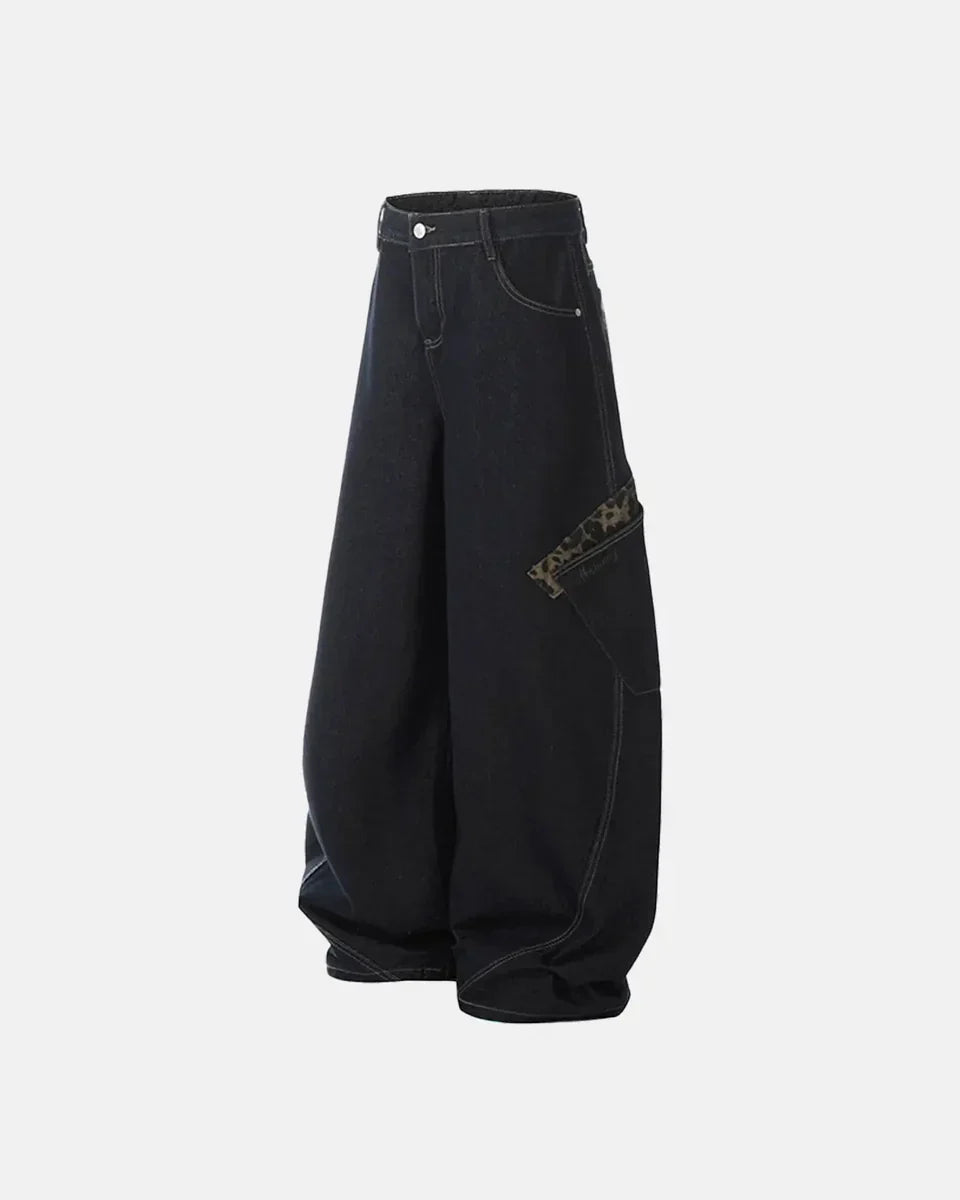 Leopard patchwork barrel jeans by Flation Streetwear featuring bold animal print and relaxed fit denim style.