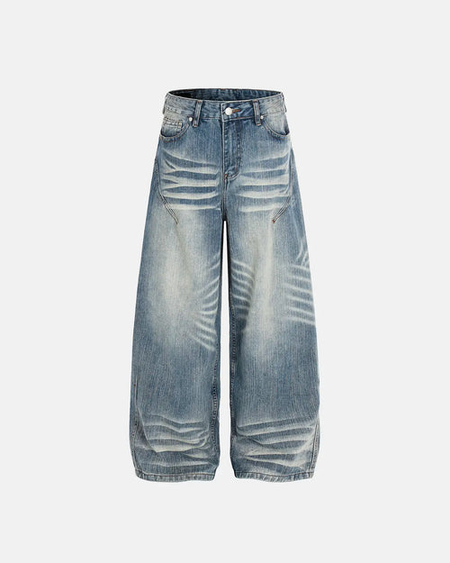 Acid wash Whisker bamboo weave jeans by INFLATION Streetwear, showing a close-up of distressed denim fabric and textured bamboo details.