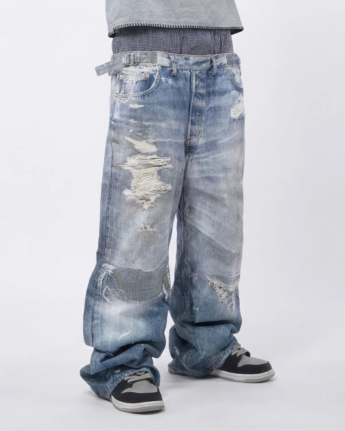Layered digital print baggy jeans by INFLATION Streetwear featuring bold, colorful design and relaxed fit with layered fabric details.