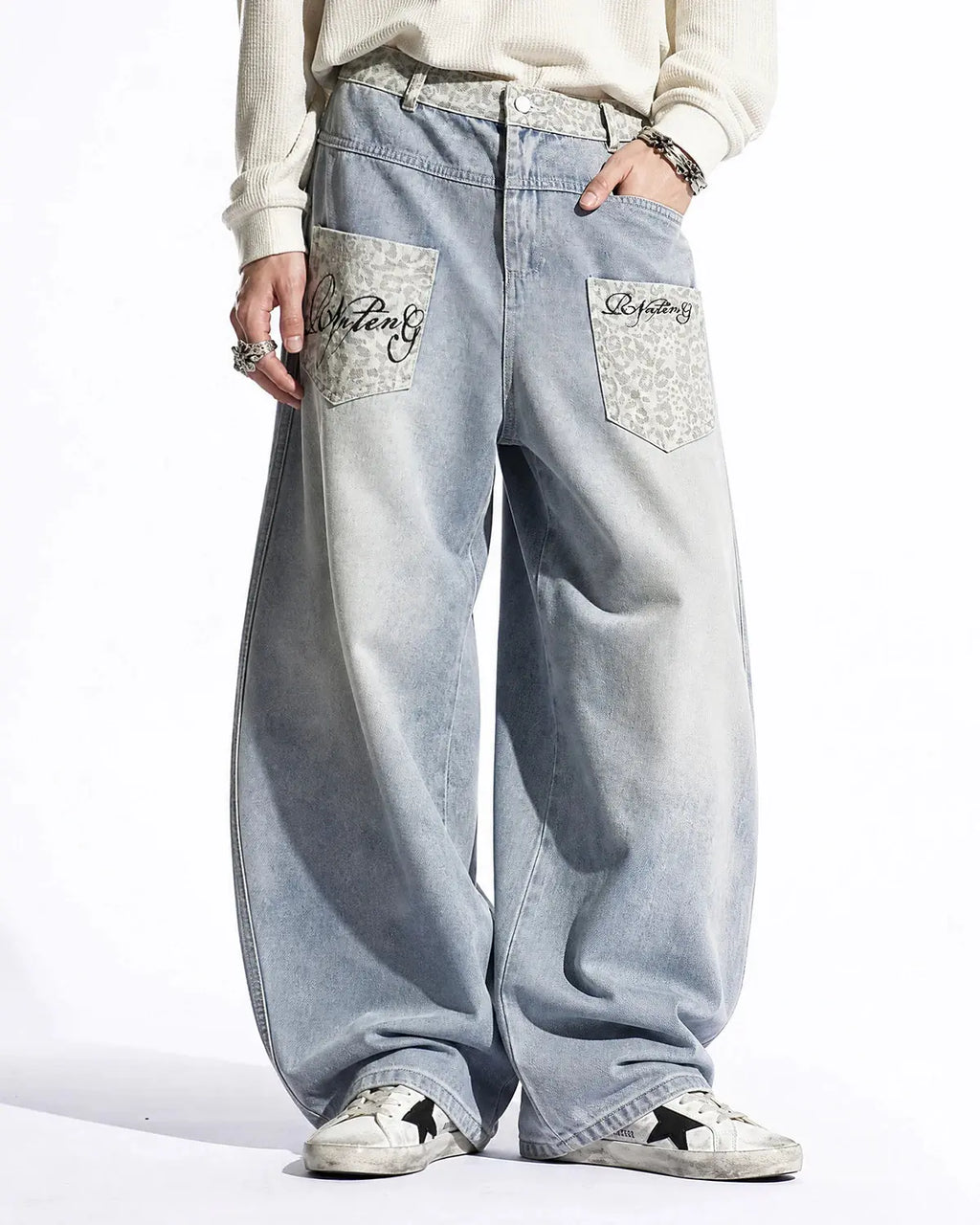 Leopard patch barrel jeans by INFLATION featuring a stylish streetwear design with leopard print patches and a relaxed fit.