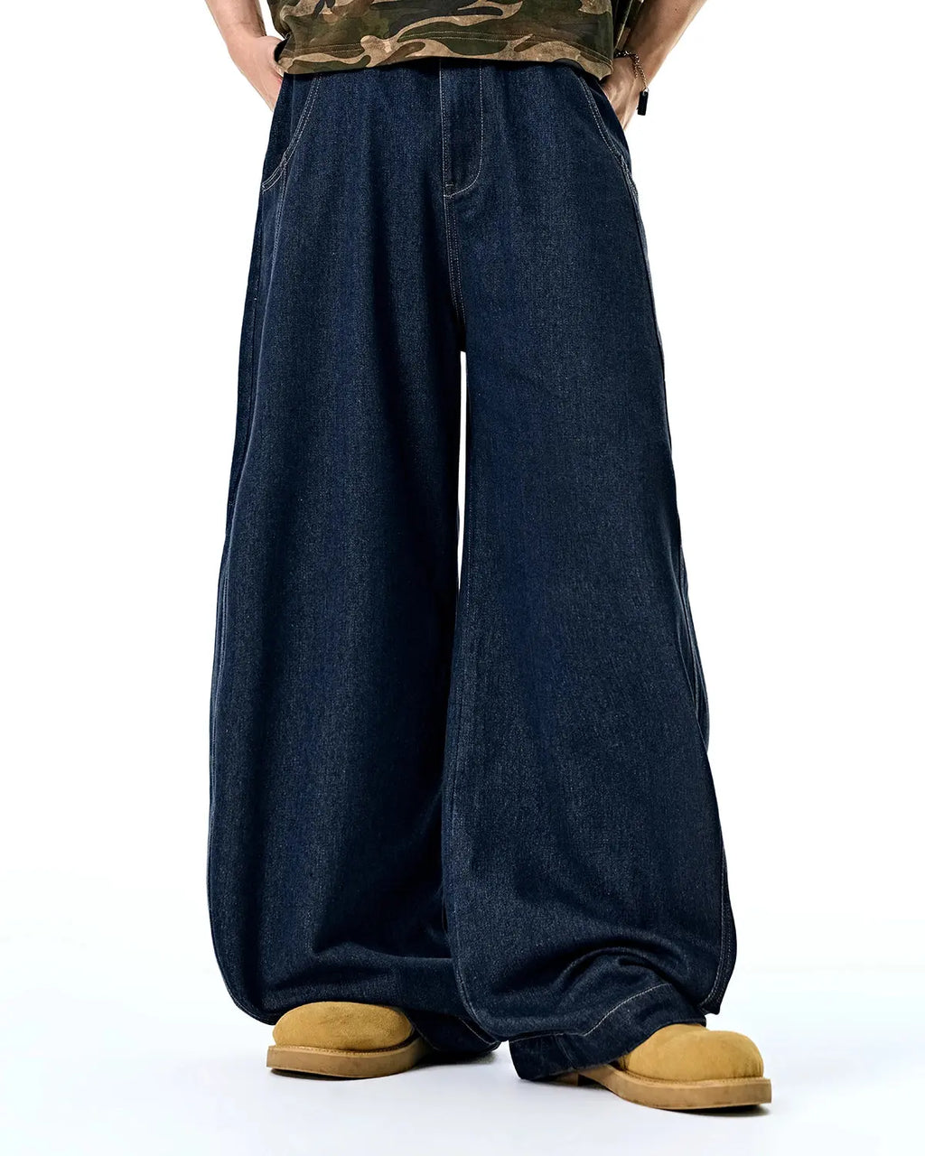 Raw Washed Barrel Jeans by Flation Streetwear, casual denim pants with a relaxed fit and distressed finish, shown on a model.