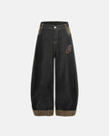 Leopard patchwork embroidery baggy jeans by INFLATION featuring bold animal print and relaxed streetwear style.