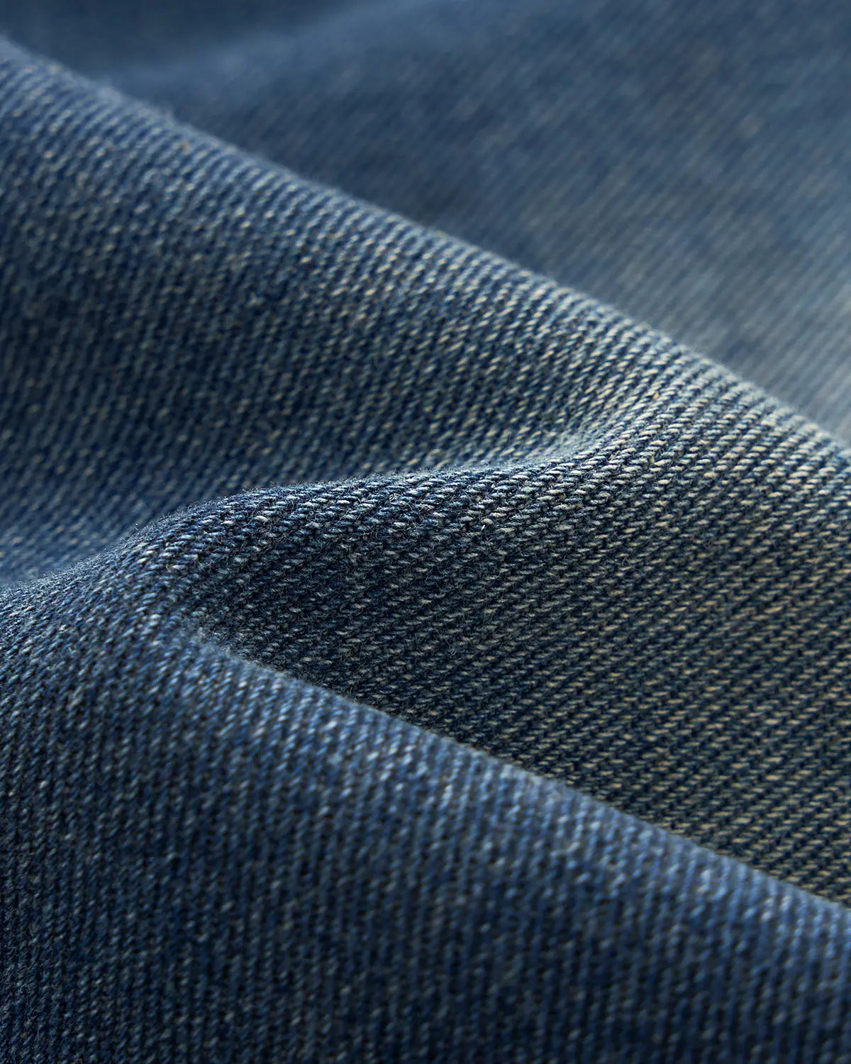 Deconstructed washed denim jorts by INFLATION, casual pants with frayed hems and a relaxed fit, styled for streetwear fashion.