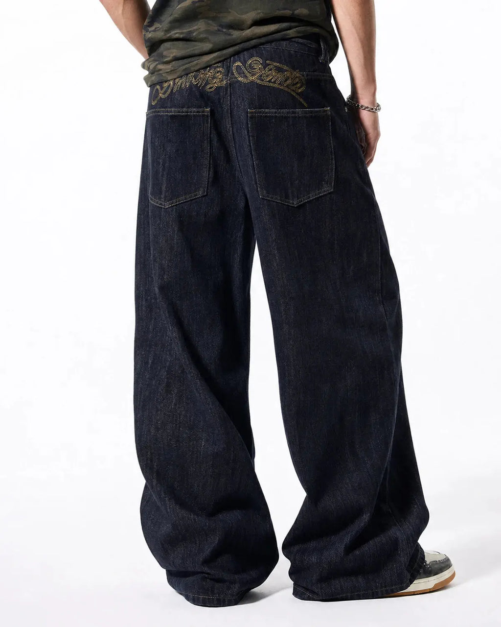 Embroidered raw baggy jeans from Inflation Streetwear featuring detailed embroidery and a relaxed fit, casual streetwear style.