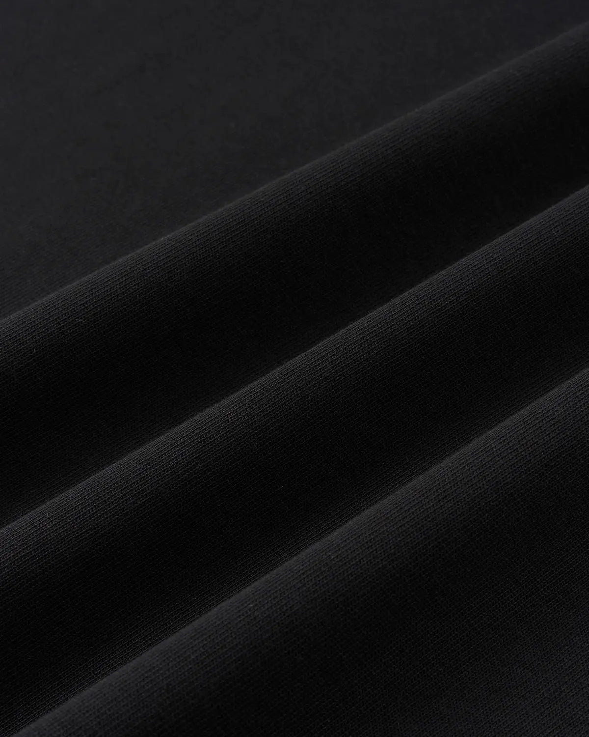 Inflation Streetwear Script Graphic Oversized T-Shirt in black with bold white lettering, casual streetwear style for men and women.