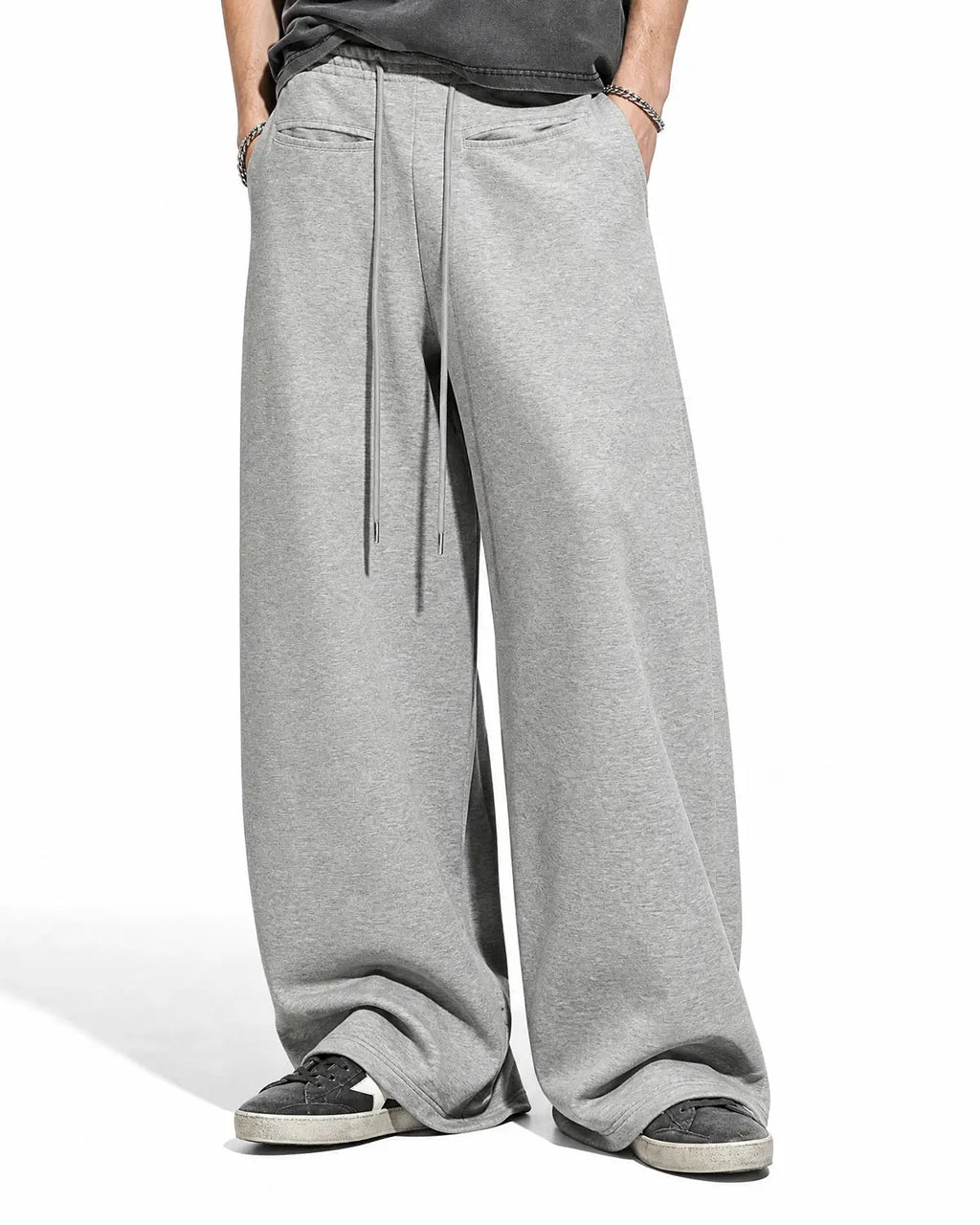 Inflation Streetwear curved wide-leg sweatpants in soft fabric, showcasing relaxed fit and stylish design.