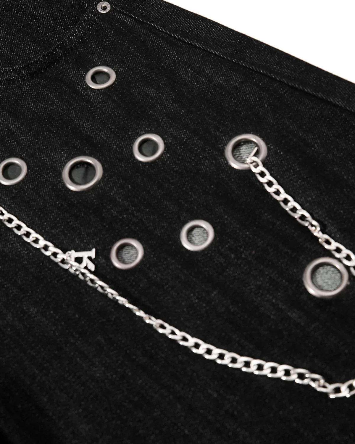 Metal eyelet chain barrel jeans by INFLATION featuring distressed denim, metal eyelets, and a relaxed streetwear fit.