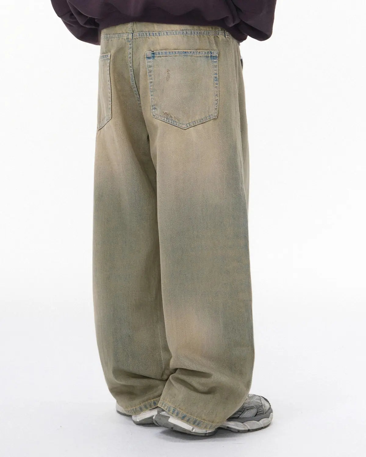 Beaded studded washed baggy jeans by INFLATION Streetwear featuring distressed denim and decorative bead and stud embellishments.