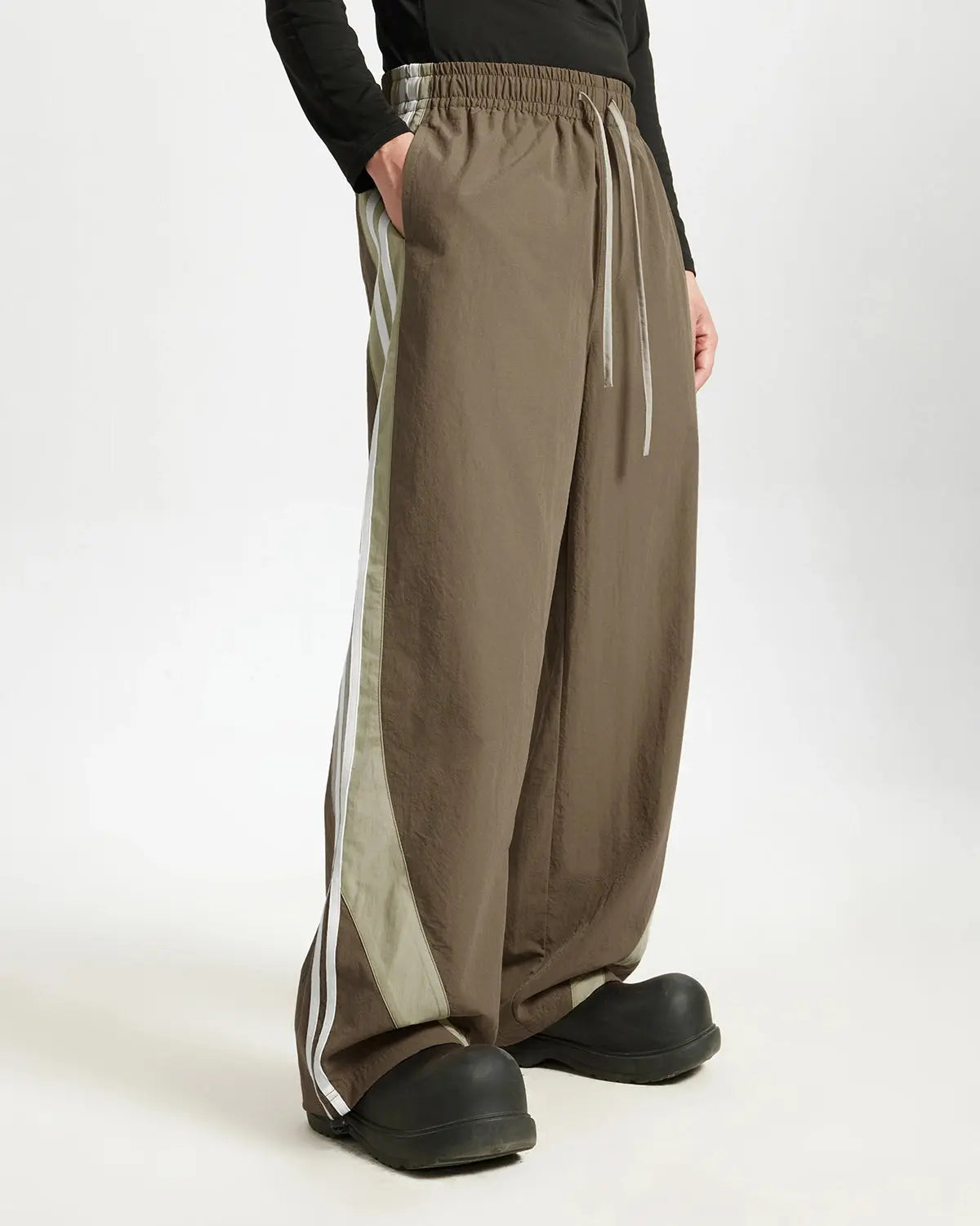 Inflation streetwear striped casual pants with relaxed fit, featuring bold horizontal stripes in various colors.