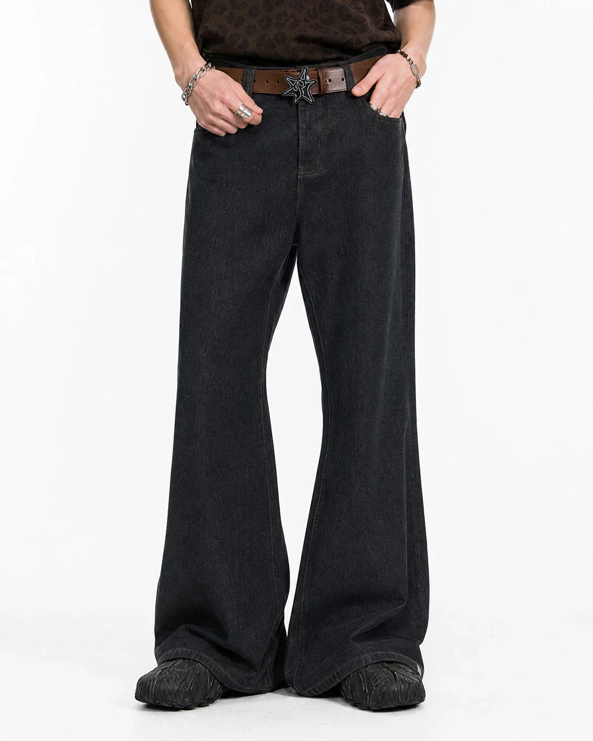 Super Raw Flared Baggy Jeans by Flation featuring distressed denim and wide-leg style on a model.