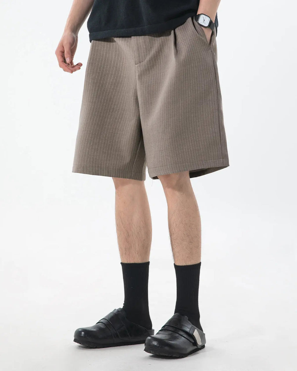 Inflation brand pinstripe pleated tailored shorts, stylish pants with a high-waisted design and sharp pinstripe pattern.