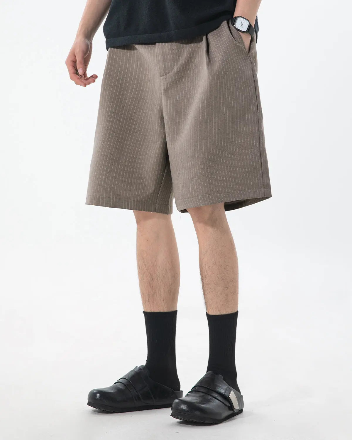 Inflation brand pinstripe pleated tailored shorts, stylish pants with a high-waisted design and sharp pinstripe pattern.