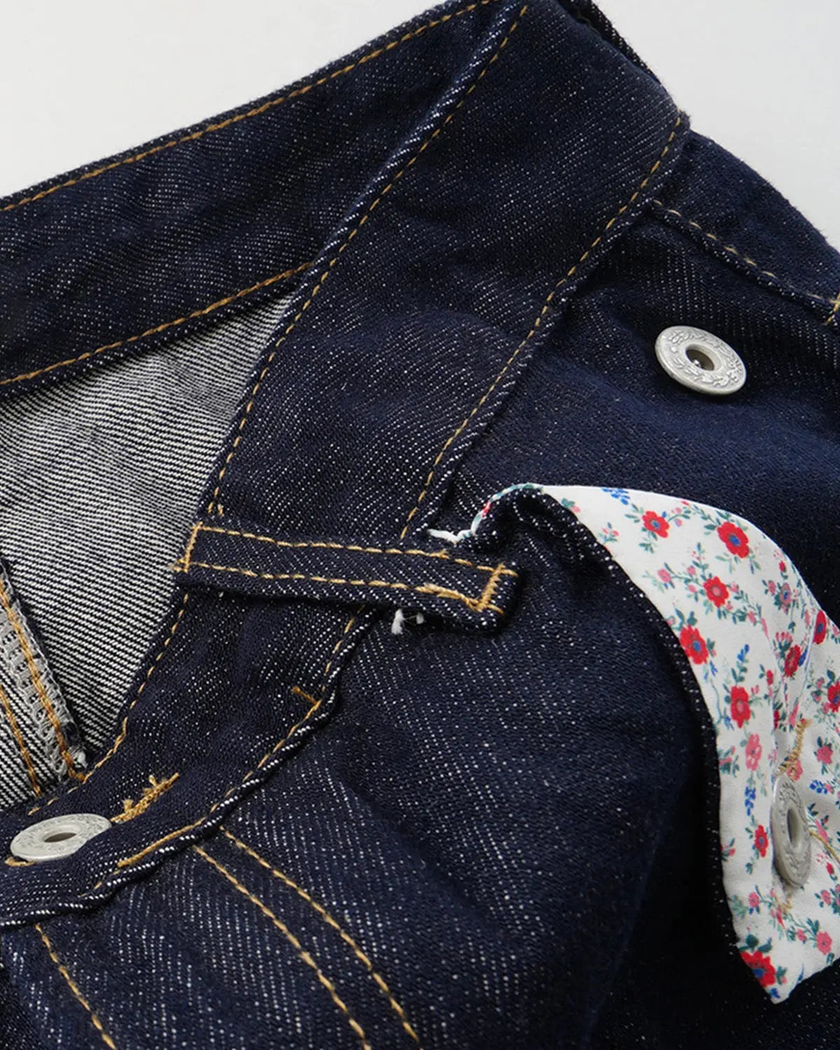 Inflation Selvedge Buckle Baggy Jeans featuring distressed denim, relaxed fit, and metal buckle detail on a casual streetwear style.