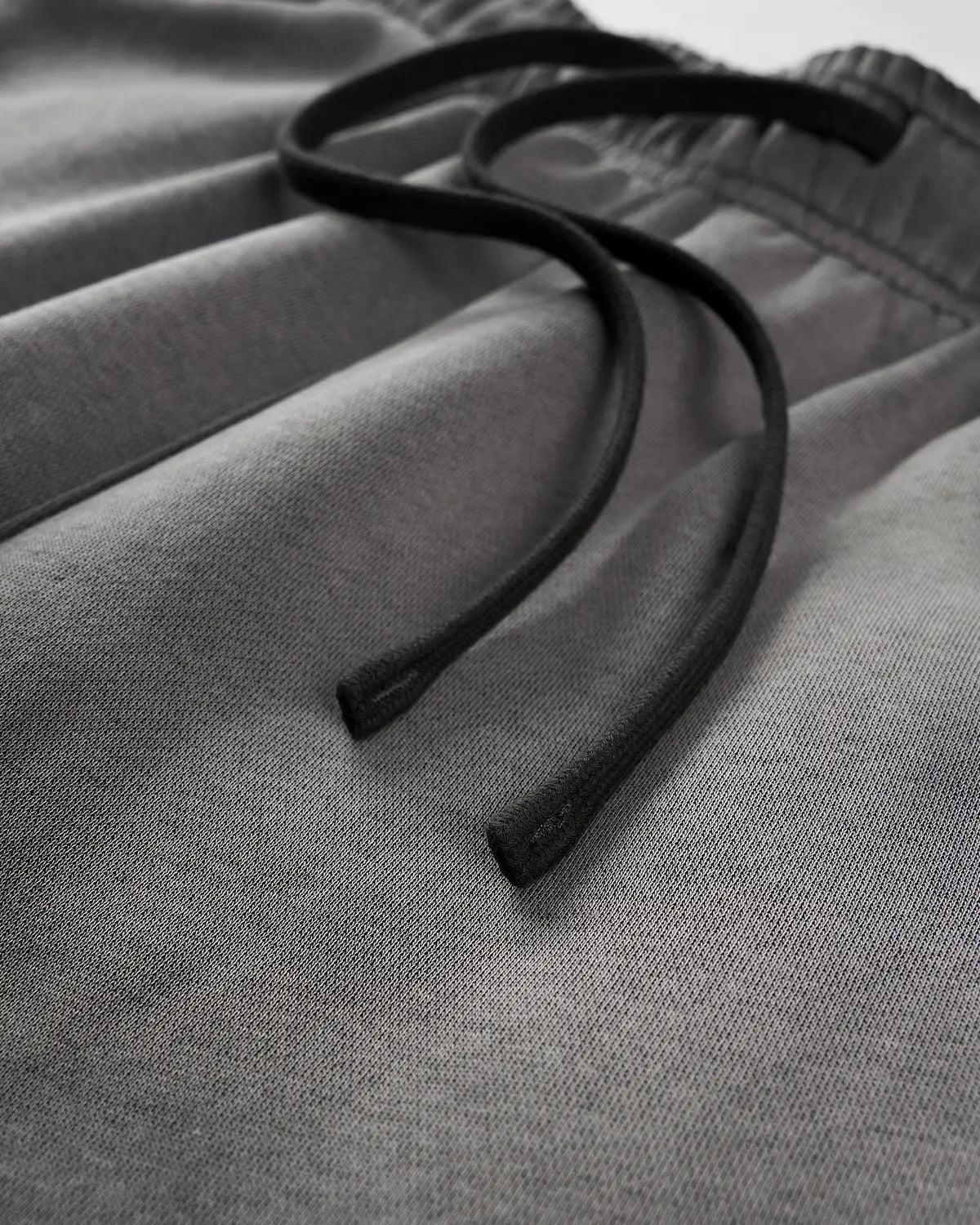 Acid washed Flation Streetwear sweatpants with relaxed fit and distressed fabric, casual urban style for comfortable streetwear look.