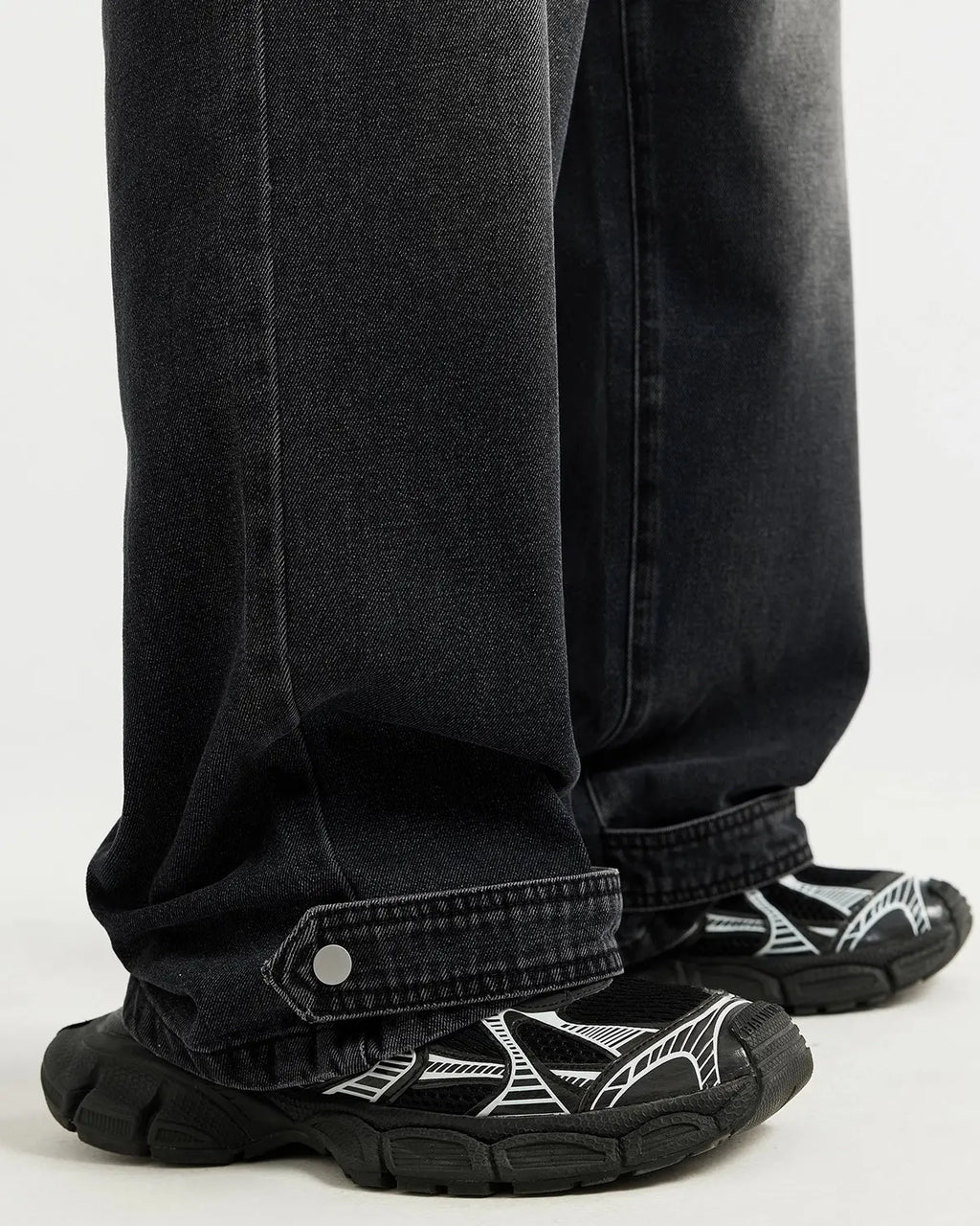 Black washed baggy jeans by Flation Streetwear featuring a relaxed fit, distressed details, and casual style.