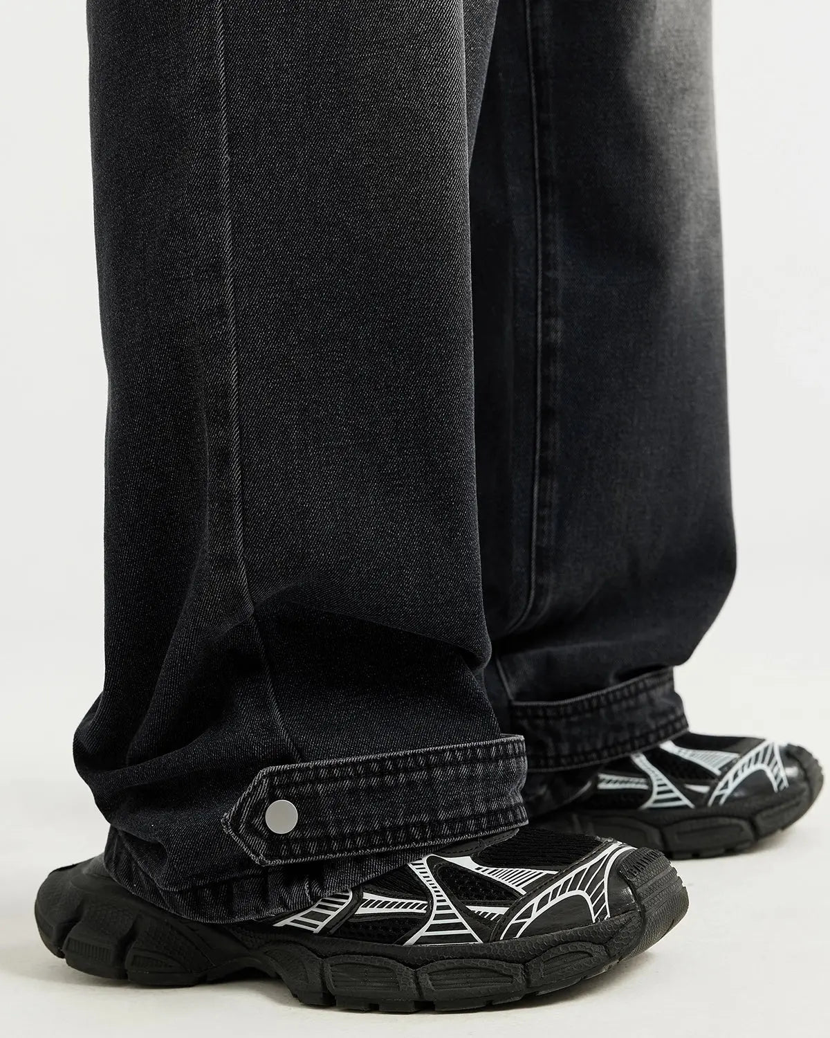 Black washed baggy jeans by Flation Streetwear featuring a relaxed fit, distressed details, and casual style.