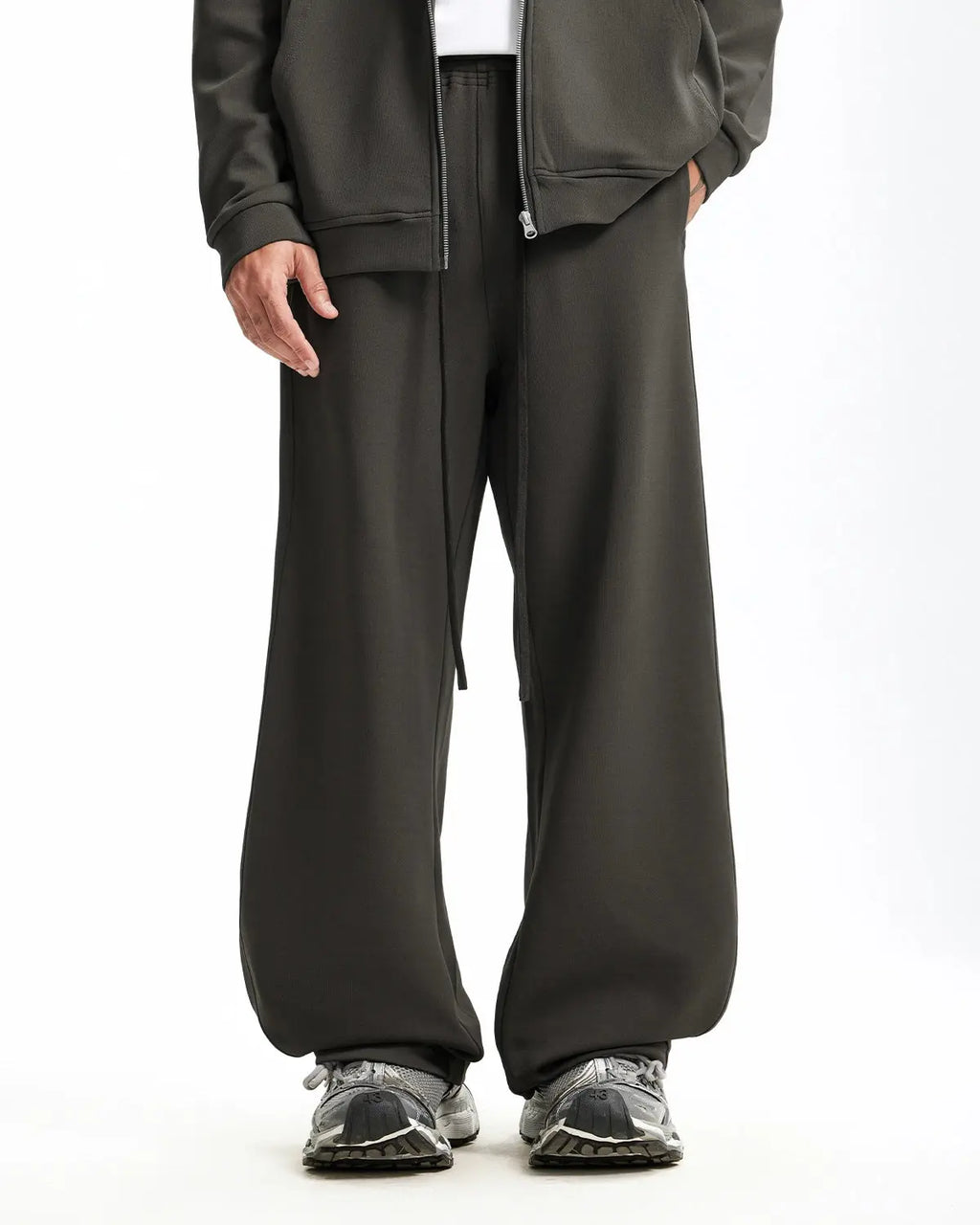 Grey baggy sweatpants by INFLATION with a relaxed fit, featuring elastic waistband and cuffed ankles, casual and comfortable.