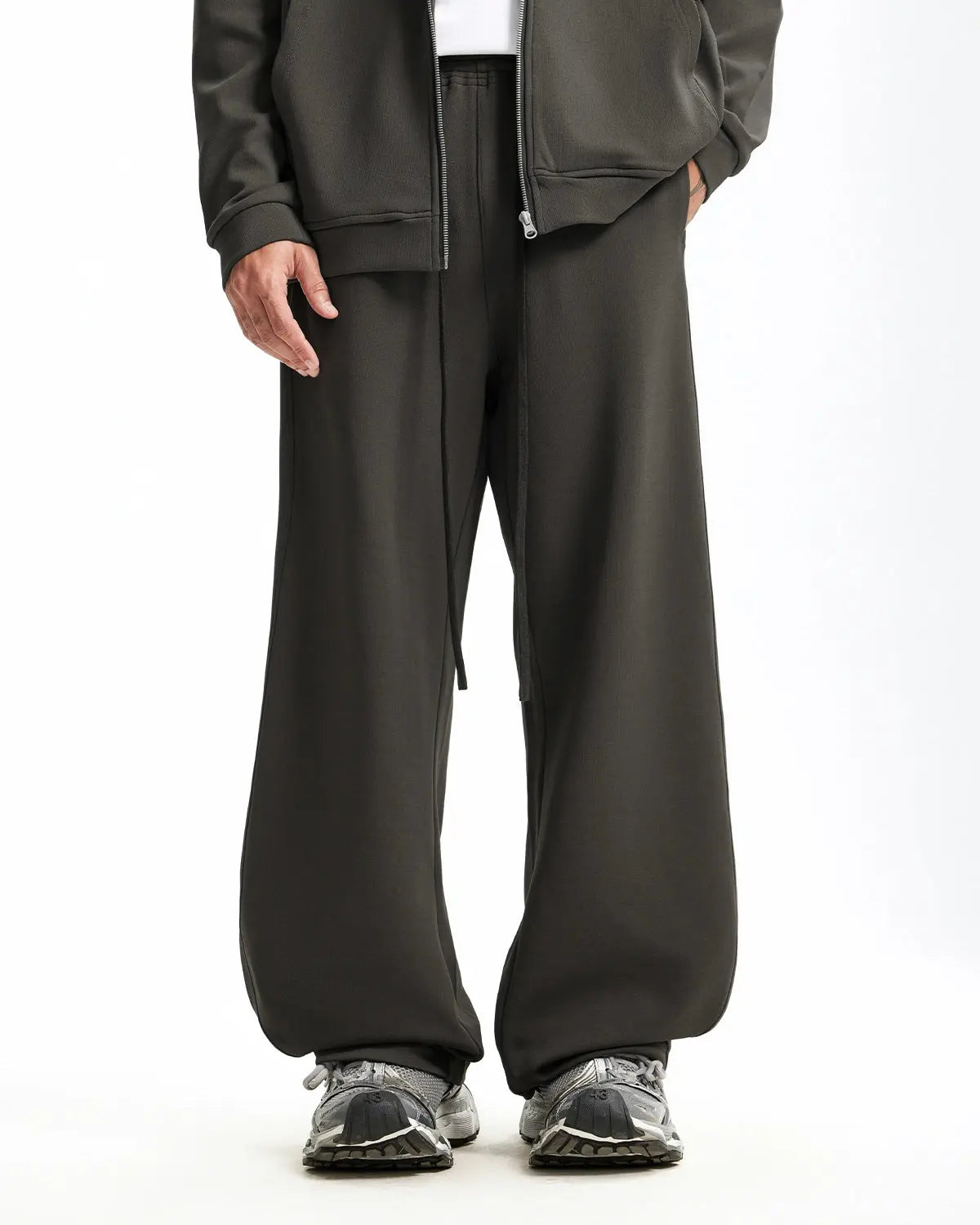 Grey baggy sweatpants by INFLATION with a relaxed fit, featuring elastic waistband and cuffed ankles, casual and comfortable.