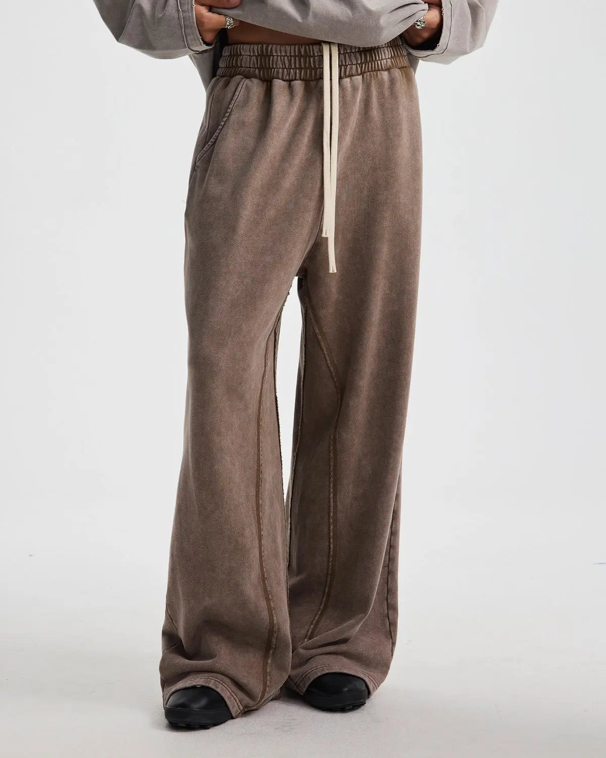 Flation straight leg acid wash sweatpants, casual streetwear pants with relaxed fit and distressed denim look, front view.