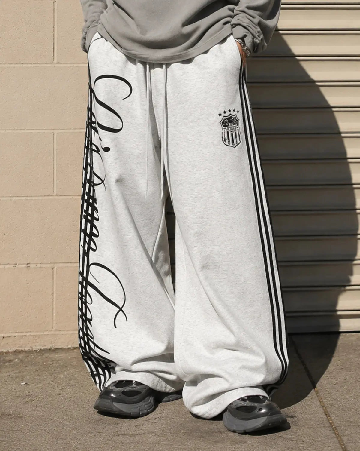 Inflation Script Stripe Baggy Sweatpants with bold stripe design, relaxed fit, and streetwear style in a comfortable fabric.