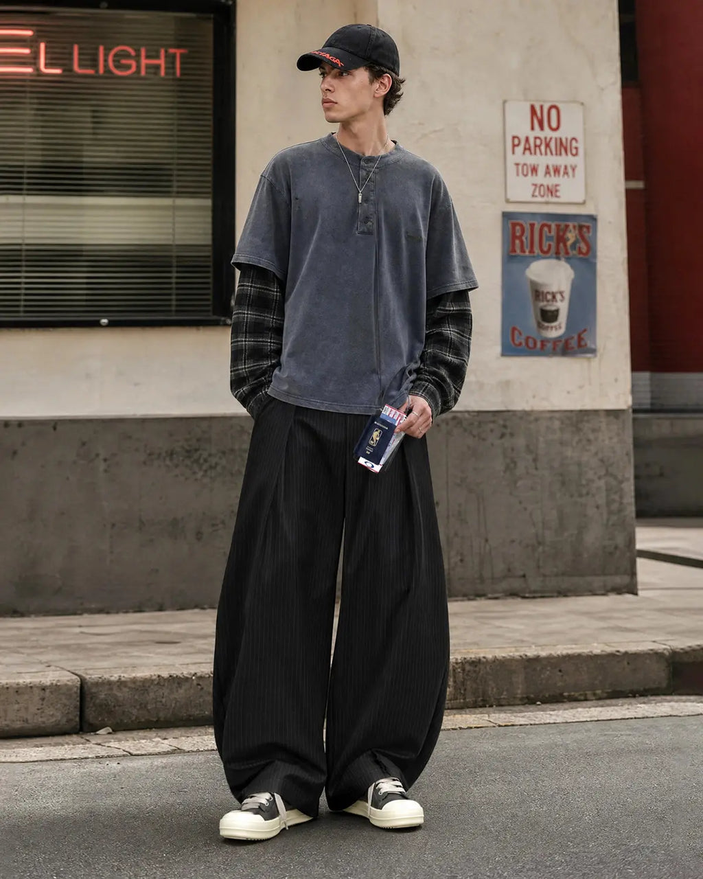 Black striped barrel suit pants by INFLATION Streetwear, featuring a relaxed fit and stylish design, displayed on a hanger.
