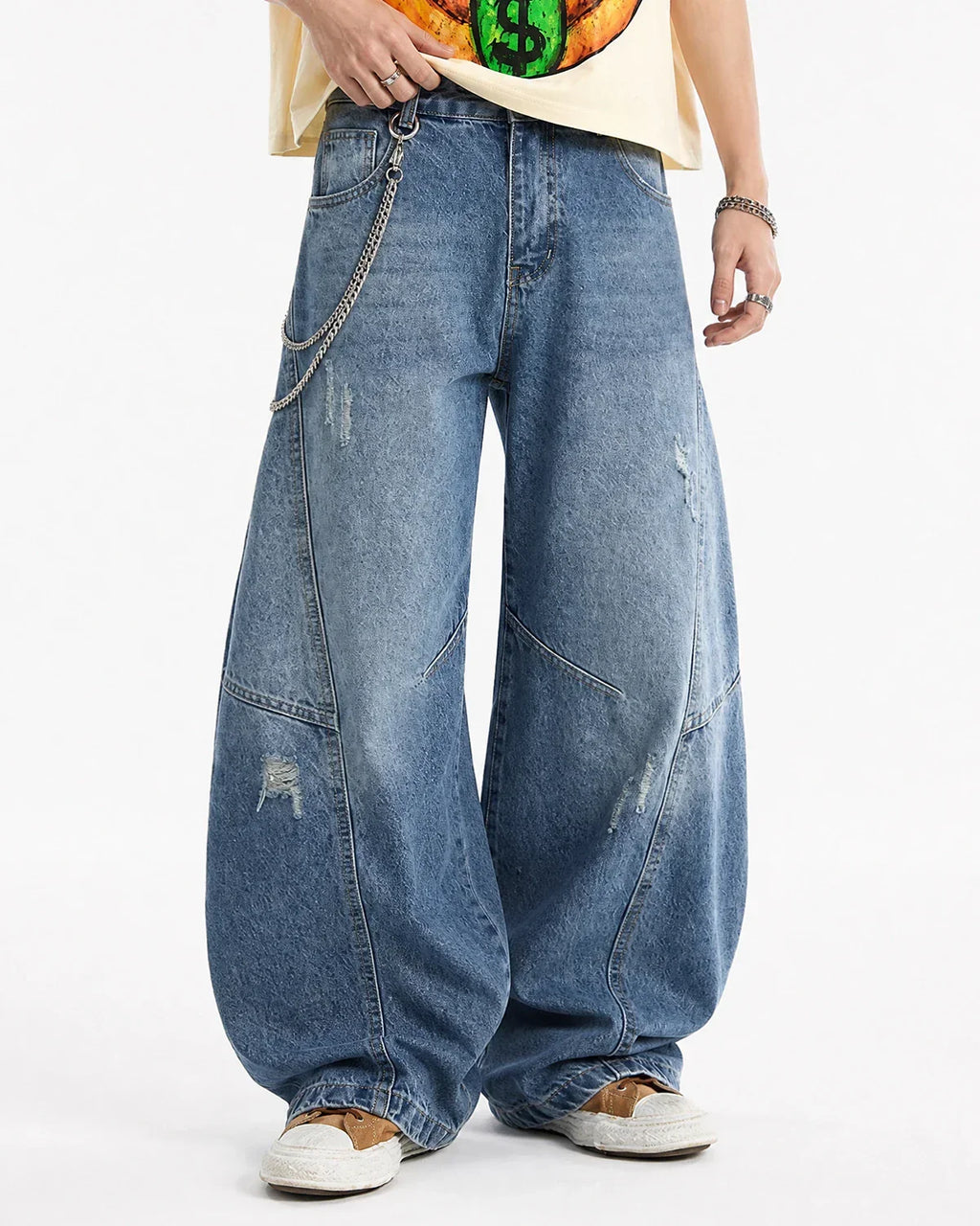 Acid washed distressed barrel jeans by INFLATION featuring a relaxed fit and frayed details in a streetwear style.