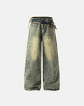 Distressed washed wide leg denim jeans by INFLATION with frayed hems and ripped details, styled with casual streetwear look.