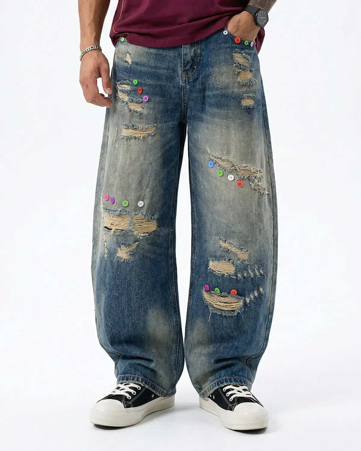 Distressed button barrel jeans by INFLATION featuring a relaxed fit and worn-in denim style, visible with distressed detailing and button closure.