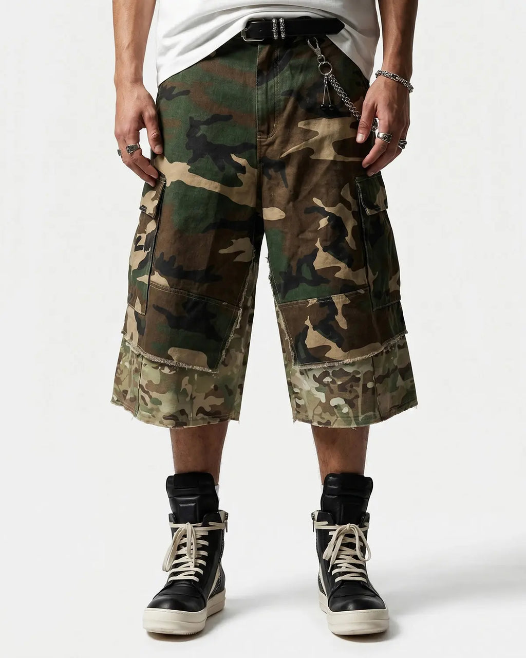 Camo layered longline jorts from INFLATION streetwear, featuring a relaxed fit and layered design with camouflage fabric detail.