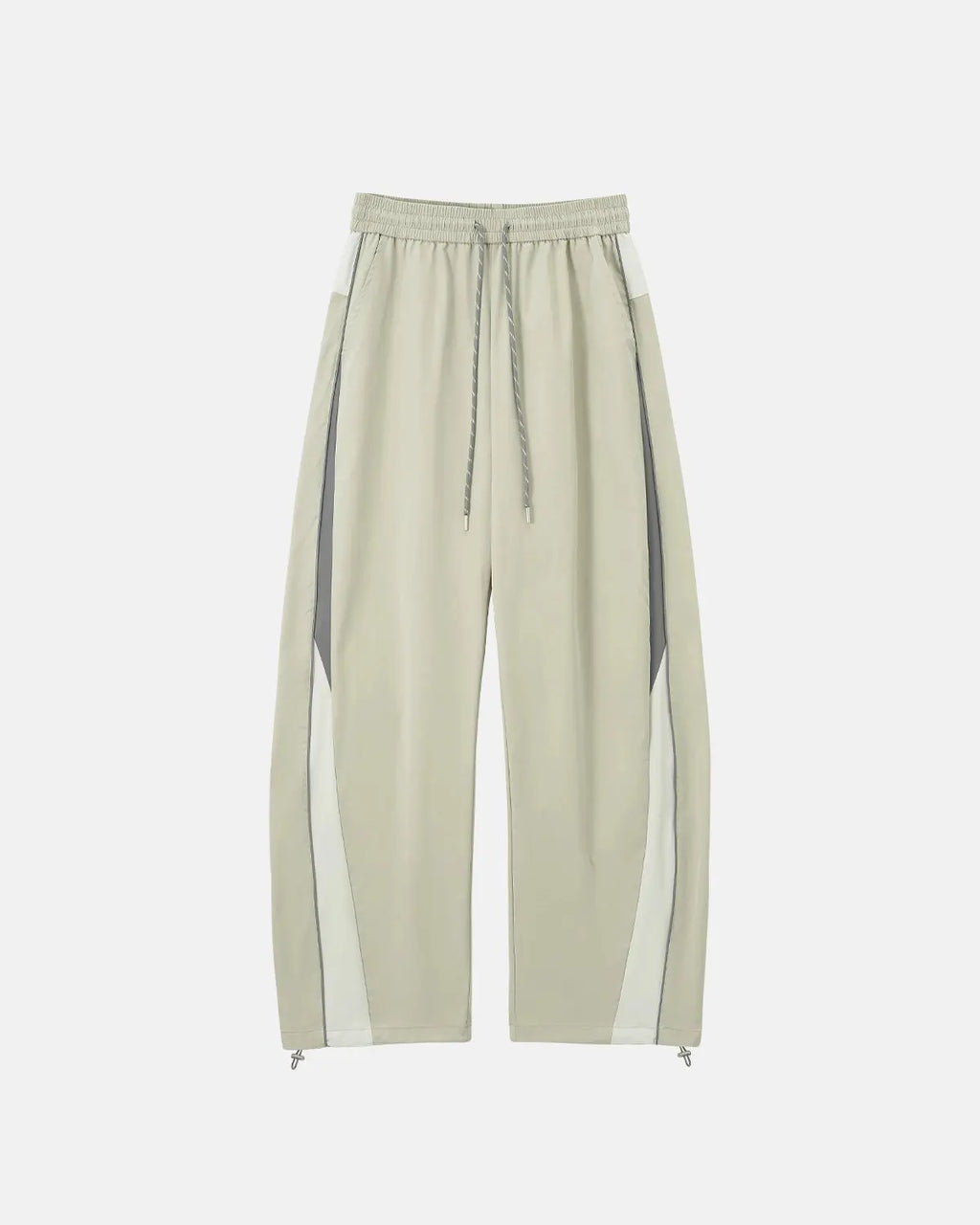 Flation Reflective Windbreaker Track Pants showing sleek black fabric with reflective detailing, designed for streetwear and active wear.