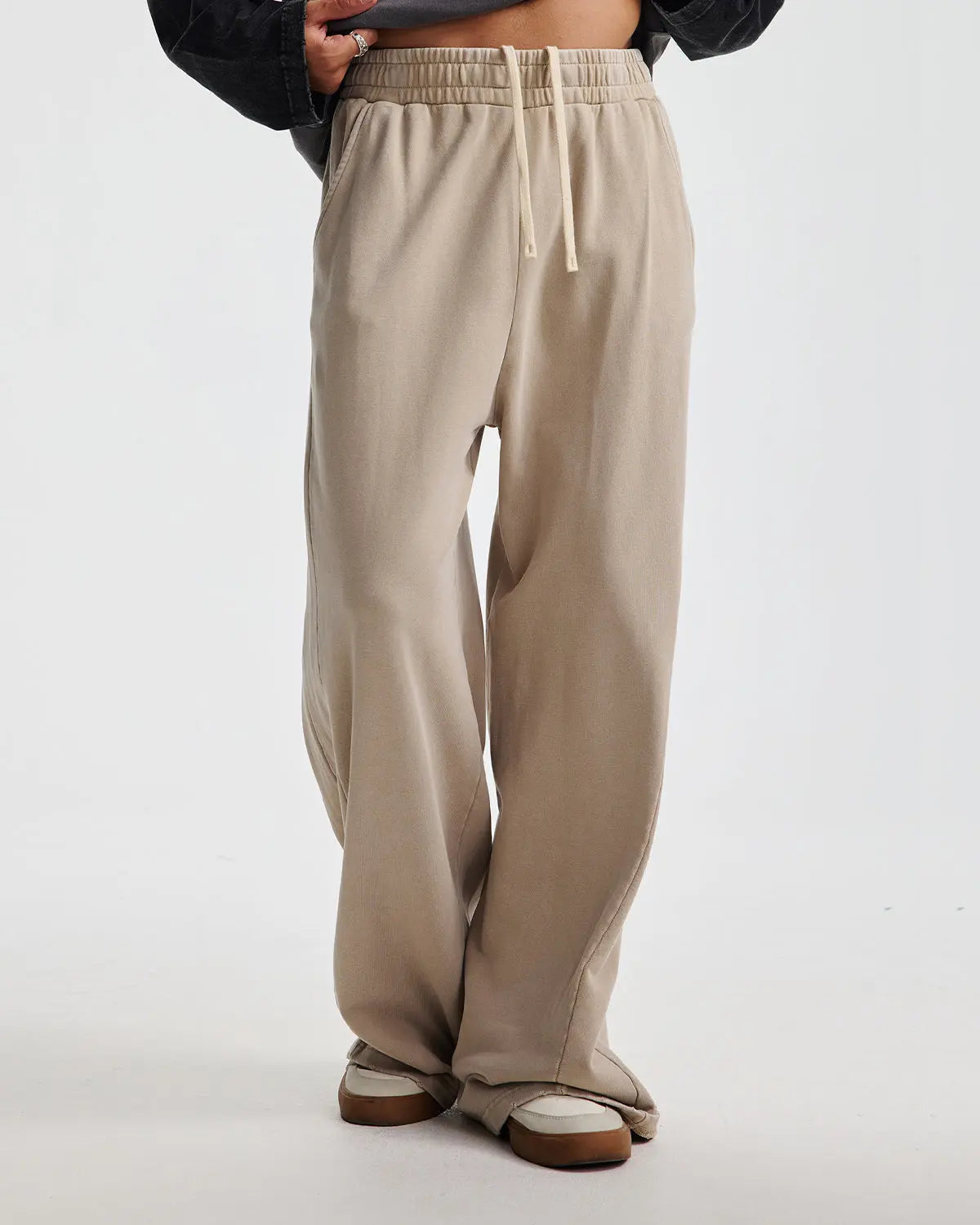 Acid wash stitching straight-leg sweatpants by Flation Streetwear, showing the distressed denim texture and casual fit.