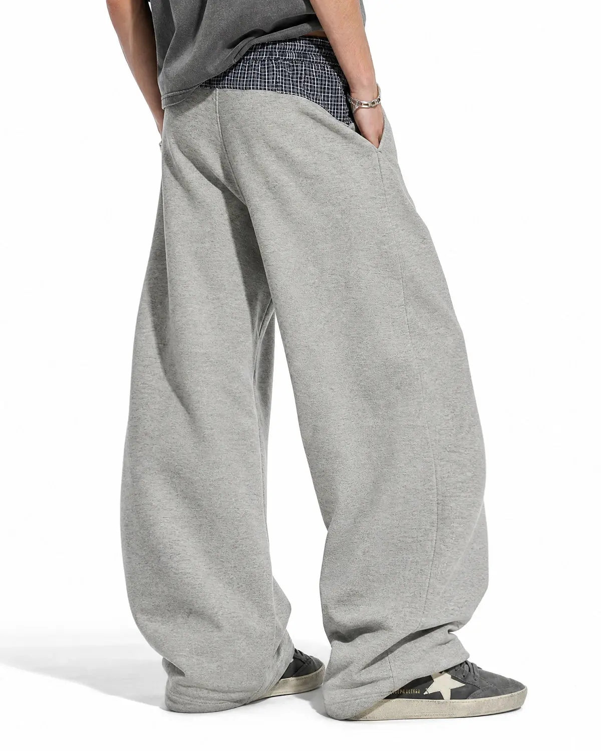 Inflation plaid layered baggy sweatpants with a relaxed fit and layered design, featuring a comfortable streetwear look.