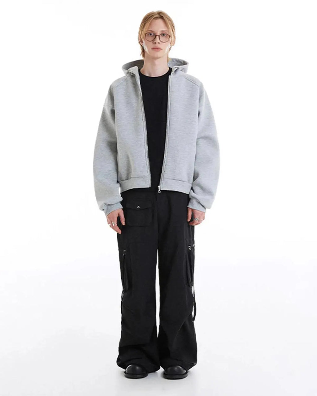 Gray Flation boxy zip-up hoodie displayed on a hanger, featuring a relaxed fit and front zipper for casual comfort.