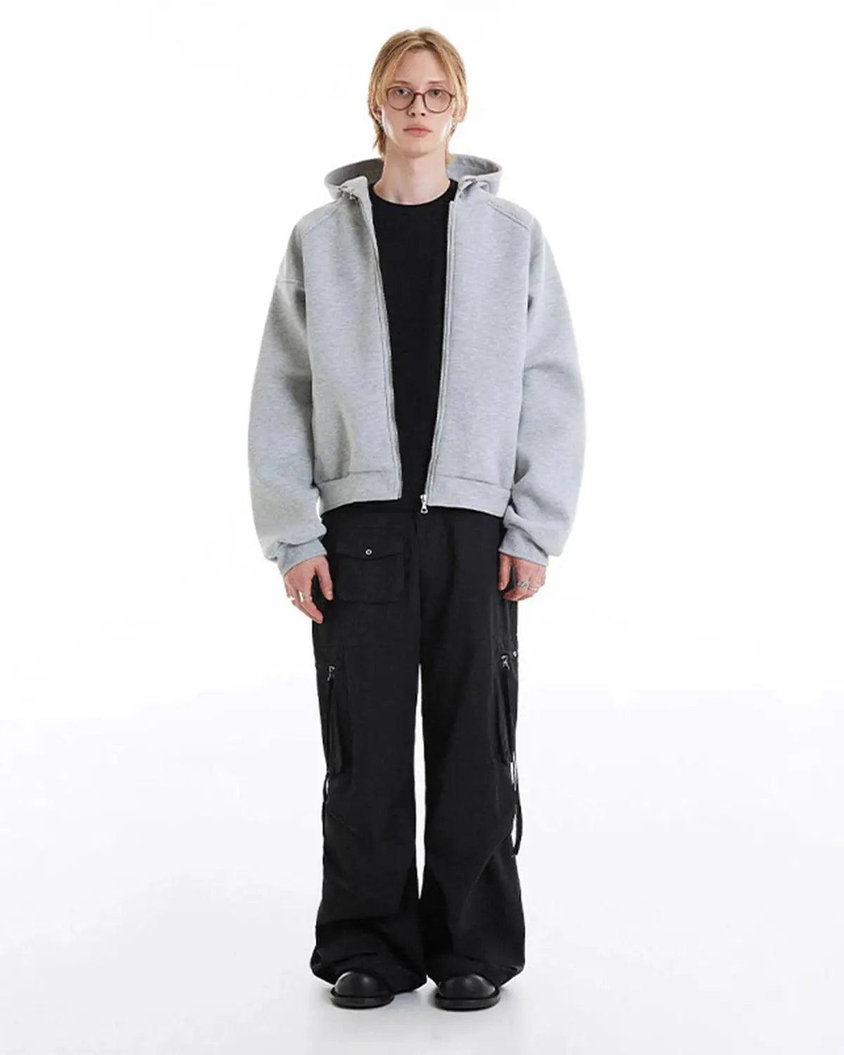 Gray Flation boxy zip-up hoodie displayed on a hanger, featuring a relaxed fit and front zipper for casual comfort.