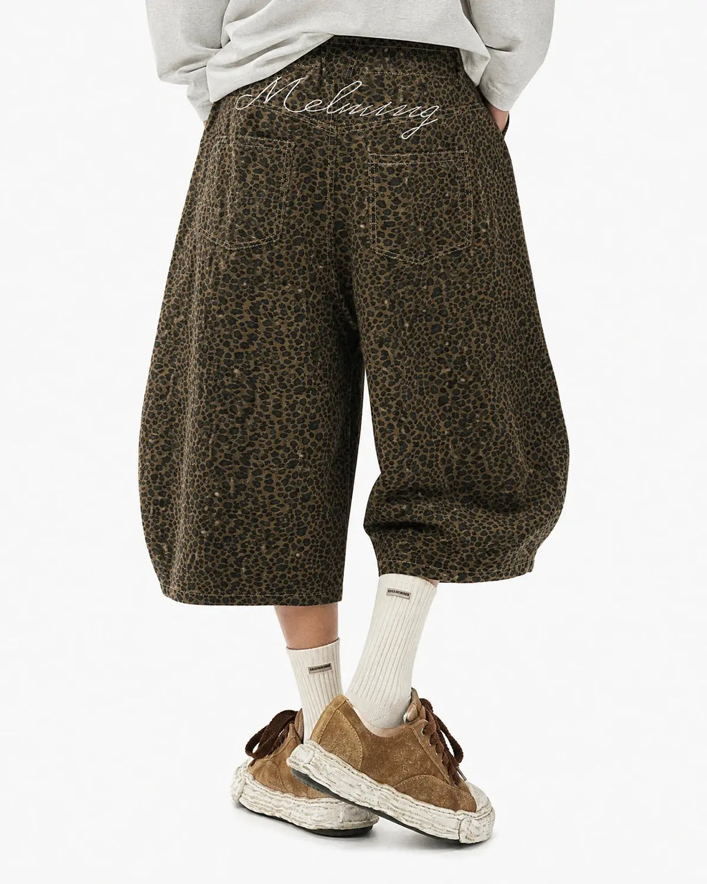 Leopard print barrel longline shorts by INFLATION, featuring a stylish long silhouette and bold animal print design.